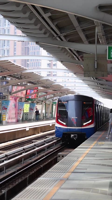 Modern Skytrain Arriving at Elevated Bangkok City Station Platform Stock Footage 324844580