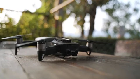Modern small quad copter drone with digital camera Stock Footage 121088907