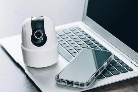 Modern Smart Home Security Device, CCTV with laptop and Smart Phone. Stock Photos