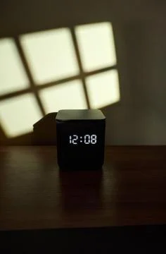 Modern Smart Speaker Displaying Time Stock Photos