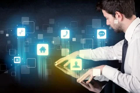Modern smart table with high tech icons on its interface screen Stock Photos