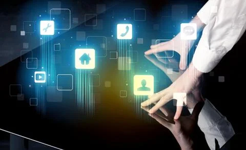 Modern smart table with high tech icons on its interface screen Stock Photos