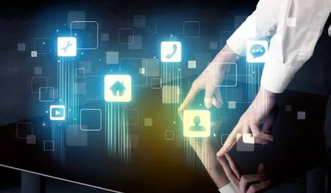 Modern smart table with high tech icons on its interface screen Stock Photos