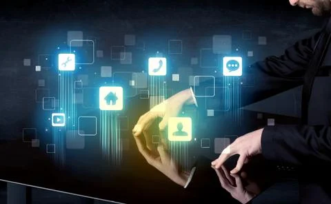 Modern smart table with high tech icons on its interface screen Stock Photos