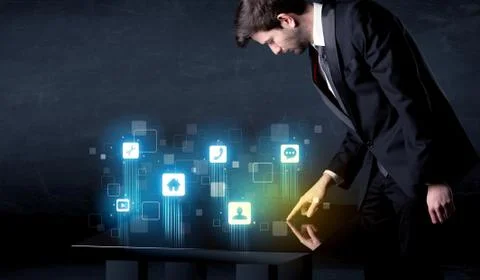 Modern smart table with high tech icons on its interface screen Stock Photos