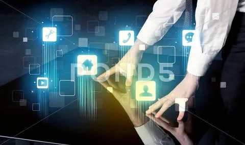 Modern smart table with high tech icons on its interface screen Stock Photos