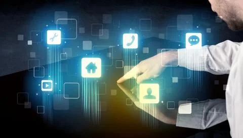 Modern smart table with high tech icons on its interface screen Stock Photos
