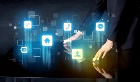 Modern smart table with high tech icons on its interface screen Foto stock
