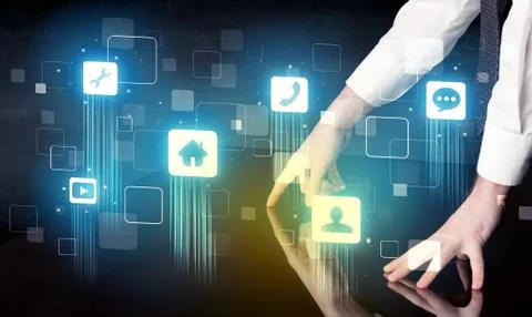 Modern smart table with high tech icons on its interface screen Stock Photos