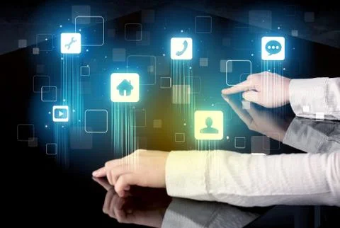 Modern smart table with high tech icons on its interface screen Stock Photos