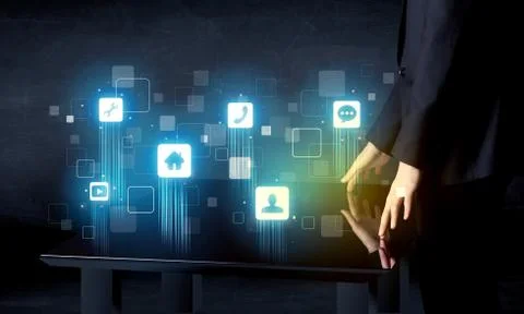 Modern smart table with high tech icons on its interface screen Stock Photos