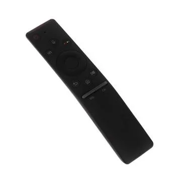 Modern smart TV remote control on a white background Stock Photos