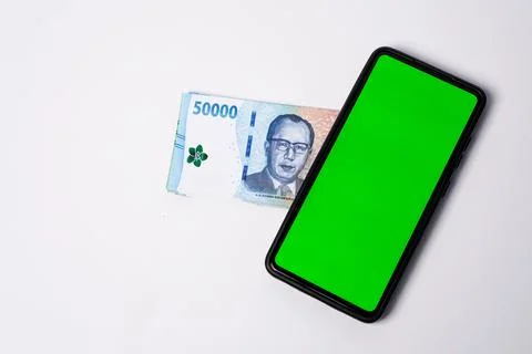 A modern smartphone with a blank chroma key green screen placed diagonally .. Stock Photos