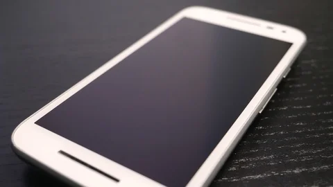 Modern Smartphone Closeup on a Table With Camera Turning Around Stock Footage 88406388