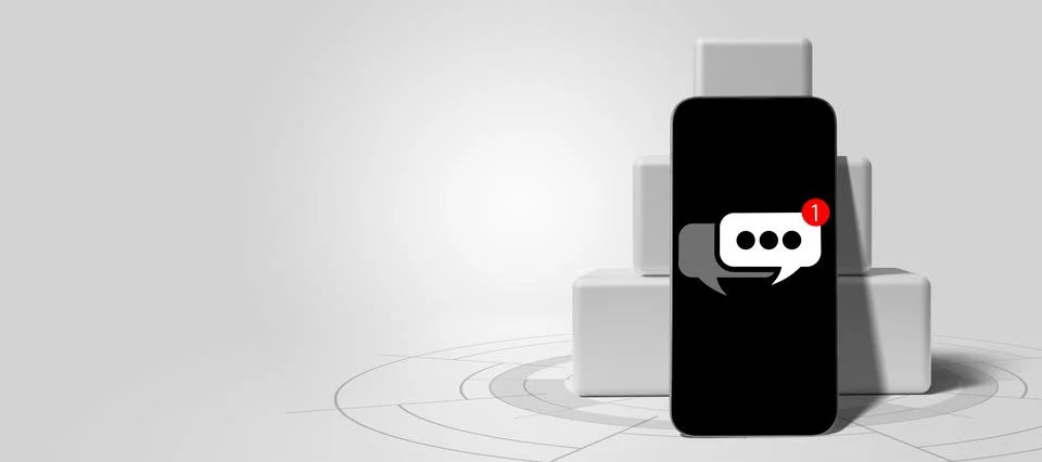 A modern smartphone featuring a chat notification bubble with a red alert b.. Stock Photos