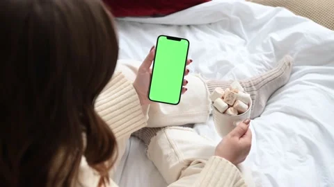 Modern smartphone in hand with green screen chromakey  Stock Footage 166178992