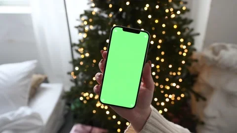 Modern smartphone in hand with green screen chromakey  Stock Footage 166179098