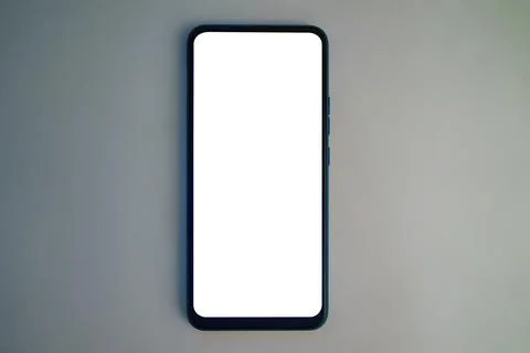 Modern smartphone on a plain surface with blank screen ready for use Foto stock