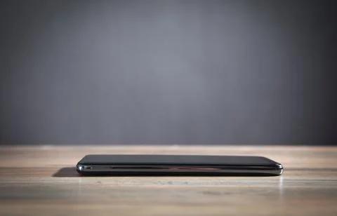 Modern smartphone on the table. Stock Photos
