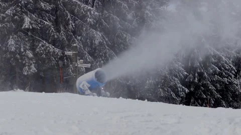 A modern snow cannon at work on a ski slope 4k 25fps video Stock Footage 297541321