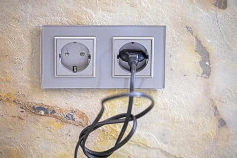 Modern sockets in the interior on a concrete wall Stock Photos
