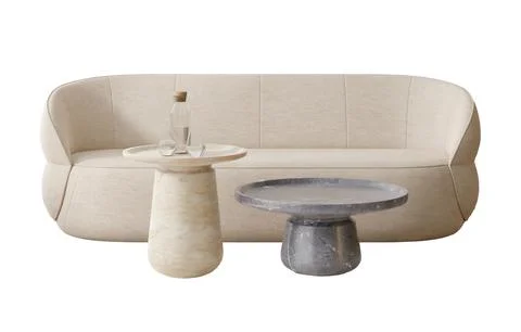 A modern sofa is showcased alongside two distinct side tables. The setting .. 写真素材