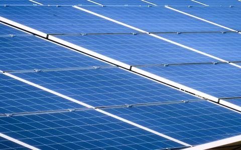 Modern Solar Panel Array Generating Clean Renewable Energy Under Sunlight Sky Stock Photos