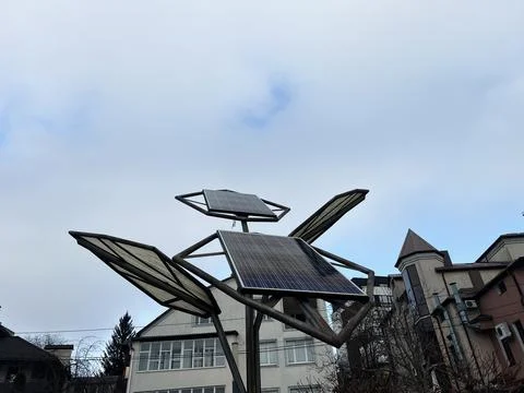 Modern solar panel array with residential buildings in the background Fotos de archivo