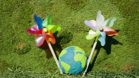 Modern source of electricity. Wind turbine on earth planet or globe Video stock 128920437