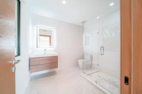 Modern spacious bathroom with shower Stock Photos
