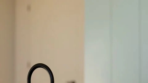 Modern spacious bright kitchen with sunlight and dark accents. 3d animation Stock Footage 237933248