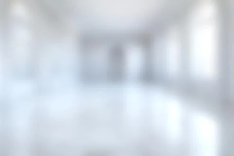 Modern spacious interior of an empty building with large windows and high c.. Foto stock
