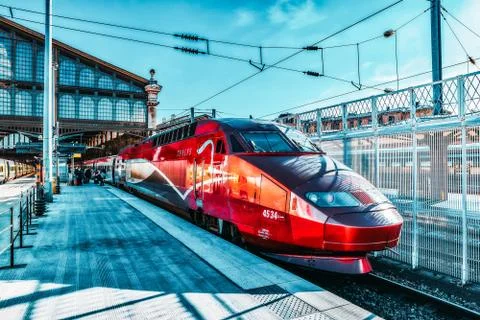Modern speed passenger train on railways station. Stock Photos