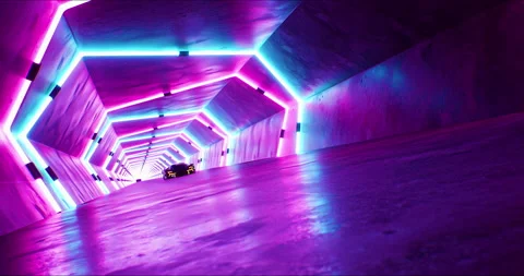 Modern speeding red car with headlights on driving fast through a neon tunnel Stock Footage 209184941