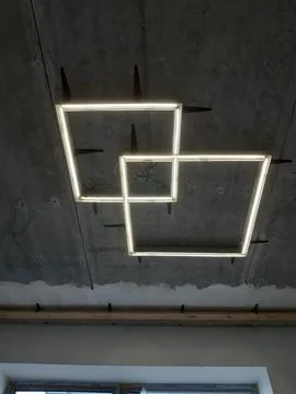 Modern Square LED Ceiling Lights Designs Lights on Exposed Concrete Ceiling Foto stock