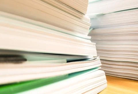 Modern stack of paper document on desk, business and finance concept Stock Photos