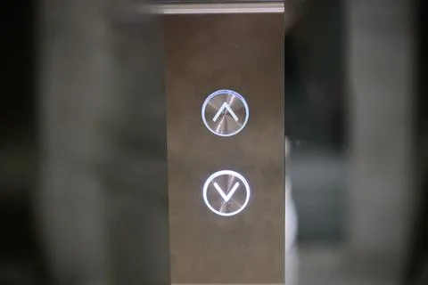 Modern stainless steel elevator control panel with metal call buttons and softly Stock Photos