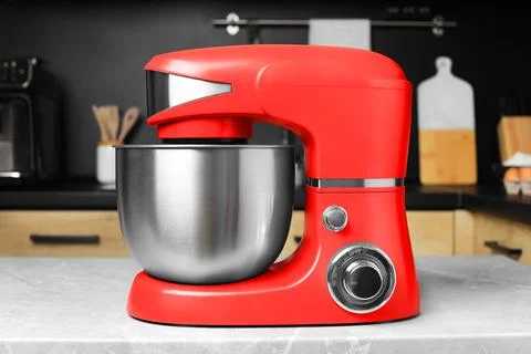 Modern stand mixer on table in kitchen. Home appliance Stock Photos
