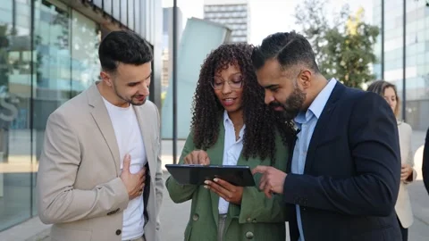 Modern Startup Business people using a tablet and discussing project near office Stock Footage 306659036