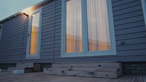 Modern static caravan. mobile House. evening time, in the windows light Vidéo 87950675