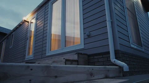 Modern static caravan. mobile House. evening time, in the windows light Stock Footage 87950775