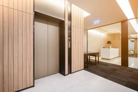 Modern steel elevator cabins in a business lobby or Hotel, Store, interior, o Stock Photos