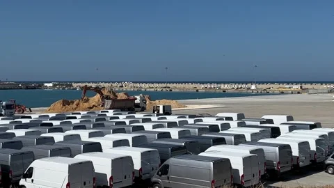 Modern stocked vans ready to be loaded at punta penna port dock Stock Footage 278823872