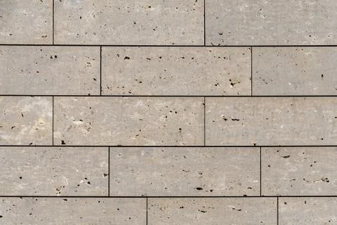 Modern stone facade texture of smooth natural stone plates at modern building Stock Photos