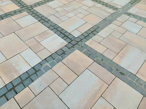 Modern stone pavement texture background with geometric tile pattern 库存照片