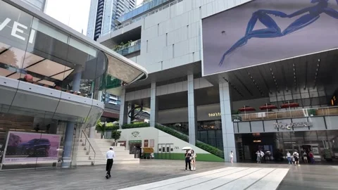 A modern storefront with glass windows and a large sign reading "huawei" above Stock Footage 287001156