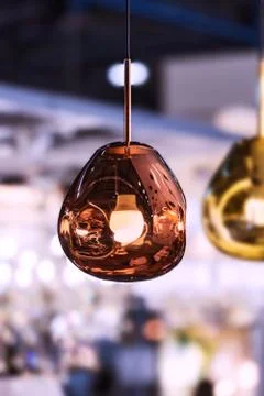 Modern streamlined mirror oval copper chandelier. Bubble metal copper gold sh Stock Photos