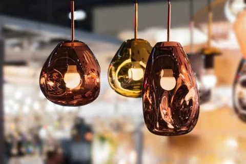 Modern streamlined mirror oval copper chandelier. Bubble metal copper gold sh Stock Photos