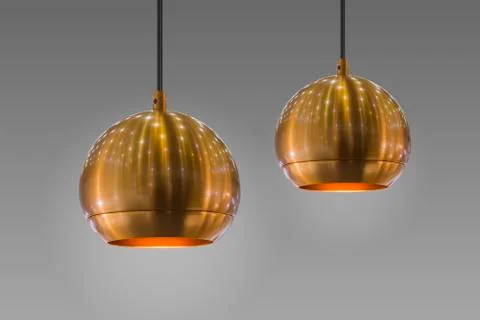 Modern streamlined mirror round copper chandelier. Bubble gold pendant light. Stock Photos