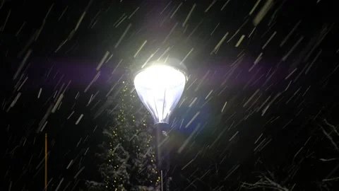 The modern street lamp during the snowfall Stock Footage 147996853
